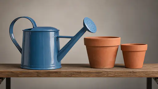 A blue enamel watering can with a long spout rests on a plain garden shelf beside two plain terracotta pots.