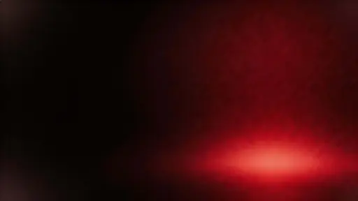 16:9 abstract widescreen wallpaper with a deep crimson light basin blooming into near-black corners, matte texture, restrained film grain, and asymmetric negative space.