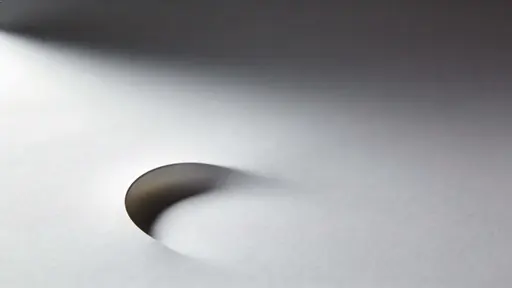 Minimal 16:9 photographic study of a faint curved shadow on a smooth blank background, rendered with soft studio light for editorial or background use.