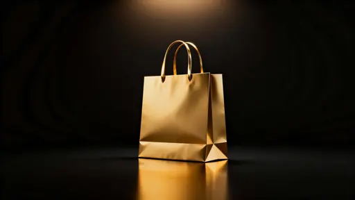 A 16:9 3D render of a single unbranded polished gold shopping bag anchored low-center on a matte black floor that melts into velvety negative space, with warm top-left glow.