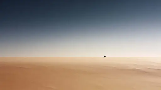 Minimal 16:9 landscape photograph of a simple horizon line punctuated by a single dot, composed for wallpaper use with calm, spacious negative space.