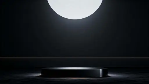 Widescreen 16:9 hero-banner 3D render of a centered low matte-black podium on a velvety near-black floor with soft top-down illumination, a subtle central vignette, and empty upper space.
