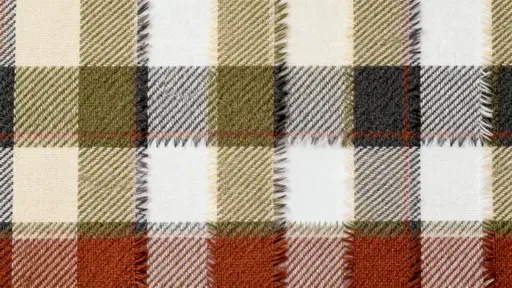 A modern plaid woven textile spans the frame in a calm, structured composition with soft intersecting bars of pine (#2F5D3A), cream (#F5F0DC), charcoal (#333333), rust (#B0552A), and warm beige (#D9C7B0), with feathered edges, flat depth, a