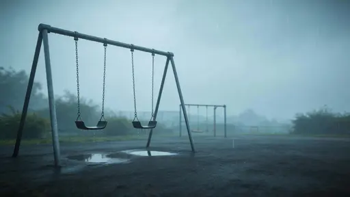 Cinematic 16:9 widescreen photograph of an empty playground swing set in steady rain, off-center with wide negative space and muted greens, grey-blues, and charcoal.