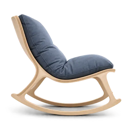 A laminated birch-plywood chair bends under a large slate-blue linen cushion, its curved legs flattening into a stable rocking base while the seat stays level and usable. Visual metaphor: resilience keeps a spare shape — adaptability preserves function under changing demands.