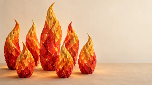 Seven flame shapes built from repeated folded paper triangles in gold, orange and warm red rise at different heights from a linen coloured table with calm space on the right.