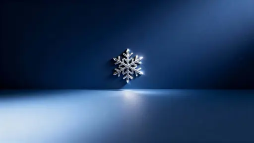 Minimalist 16:9 scene with one intricate metallic silver snowflake placed slightly above center on a deep midnight-blue gradient that darkens toward the corners, softly lit from lower-left with a faint edge glow and a clean lower-half copy‑