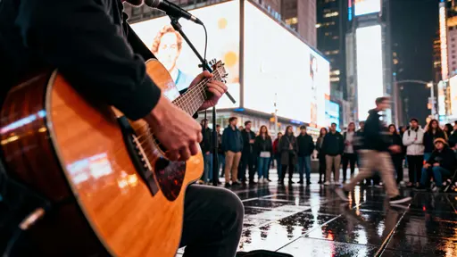 A cinematic 16:9 photo of a street performer playing guitar beneath glowing billboards with a crowd around and wet ground reflecting neon city lights.