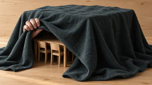 A veil of secrecy: a heavy dark veil hangs over a miniature wooden meeting table with six small chairs, fully concealing them except where a small hand lifts one folded-back corner to reveal the table edge and chair backs in soft light.