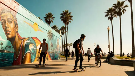 Skaters and cyclists glide along Venice Beach boardwalk beneath swaying palms and vivid murals, bright midday sun, natural reflections, and lively travel energy.